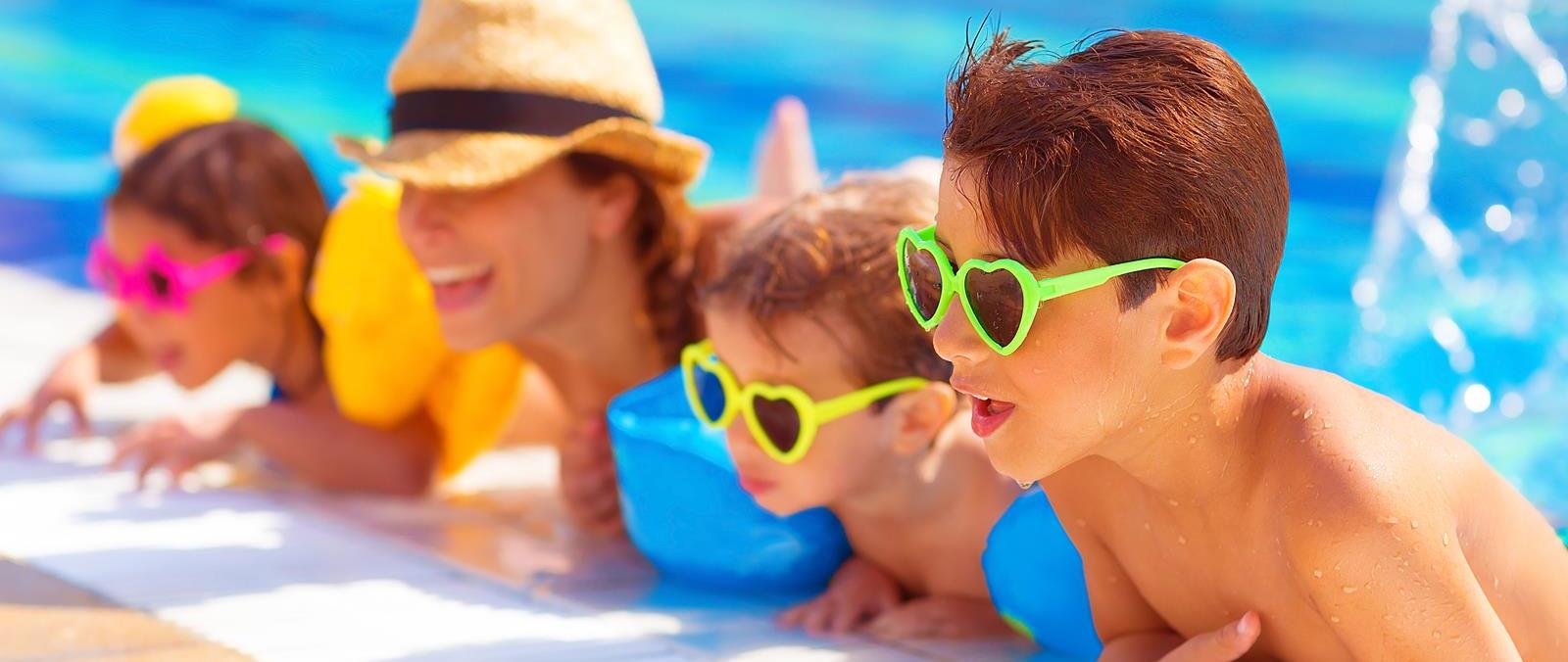 bigstock-Happy-family-in-the-pool-havi-50515637